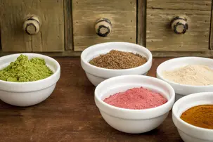 extracts and powders in white bowls